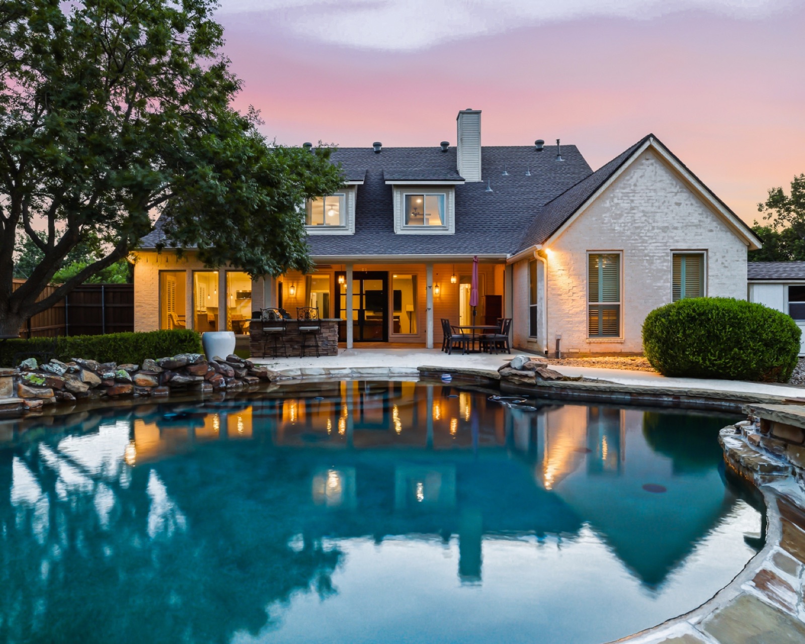 Twilight pool and patio of a Colleyville listing photographed by Rosse Media