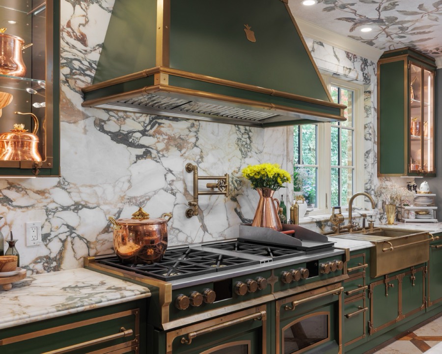 Custom green and brass kitchen with marble