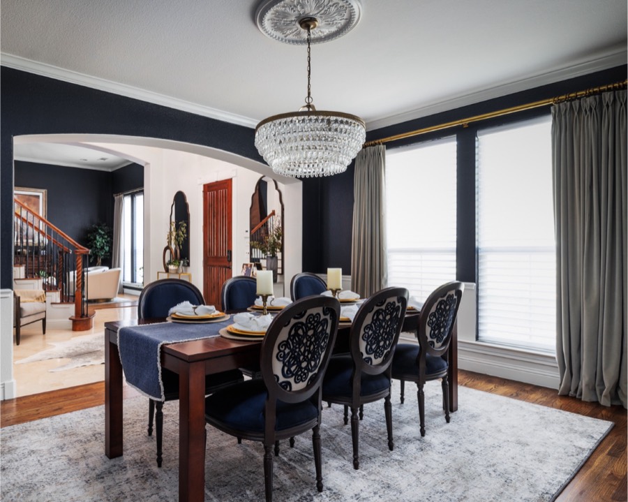 Navy dining room with crystal chandelier
