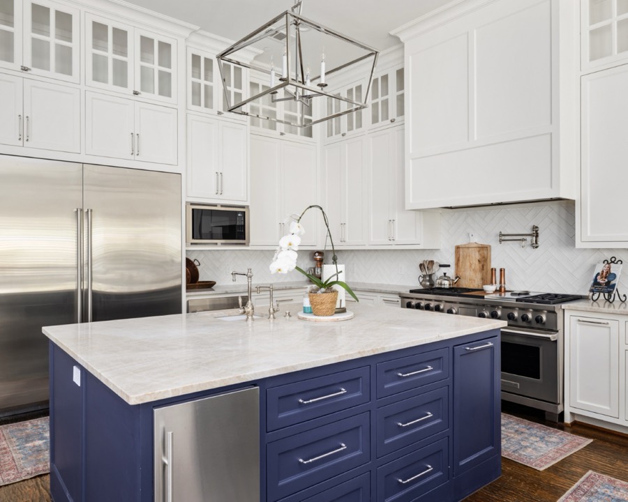 White kitchen with navy island