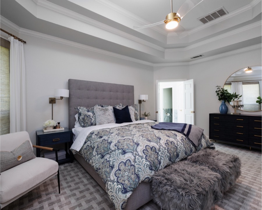 Primary bedroom with tufted headboard