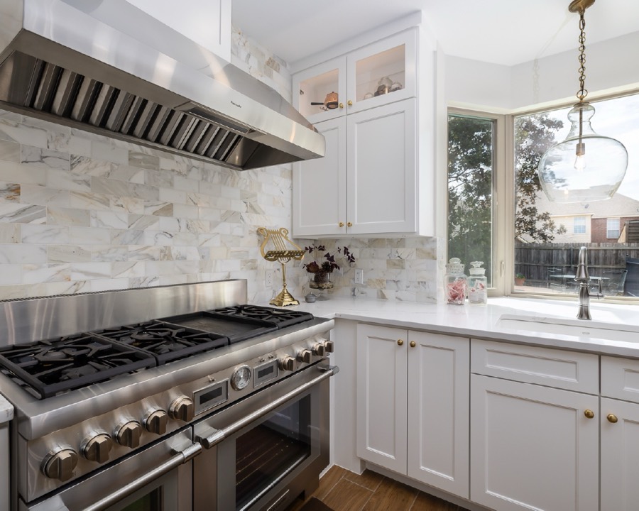 Professional range in a white kitchen